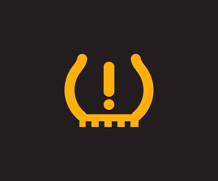 TPMS warning light indicator on dashboard requiring tire pressure check